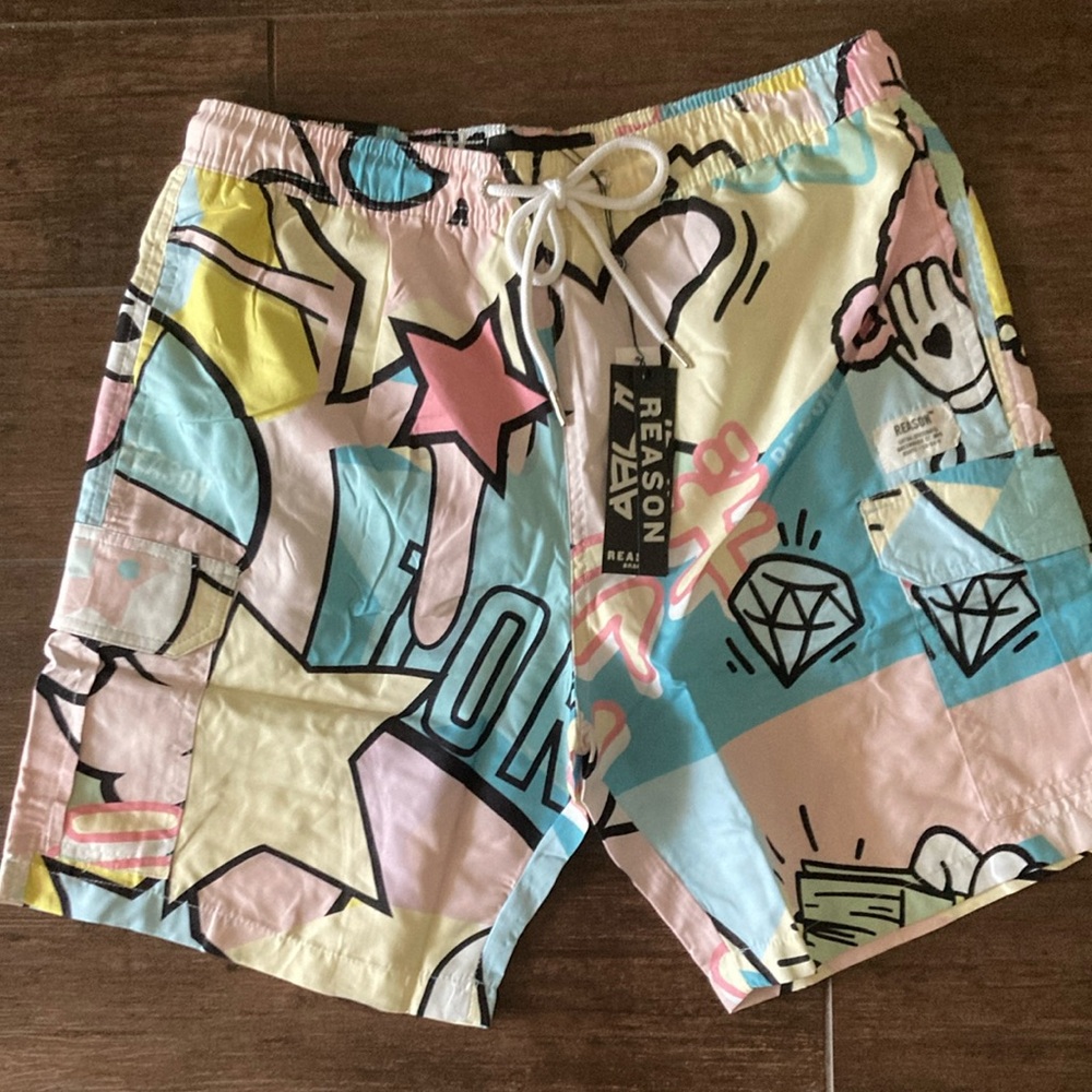 Reason Blue and Pink swim trunks with Cartoon Print. Mens medium
